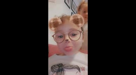 Kid falls in background of Snapchat video