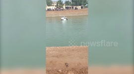 Rookie  driver steps on accelerator mistaking it for brake, plunges car into river; miraculously survives in central India