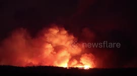 Fire and smoke engulf the landscape as fires continue to rage in Australia