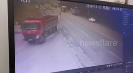 Chinese biker miraculously survives after being run over by truck