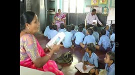Four classes share one small room in crowded Indian school