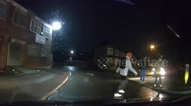 Car mounts pavement nearly hitting group of youths in Birmingham, UK