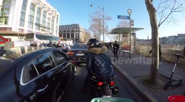 Paris road rage: Scooterist in bus lane spits on a taxi