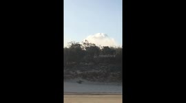 Helicopter picking up water for Australia’s bushfires.