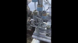 The man makes the mini water wheel to decorate the fish tank from plastic waste
