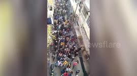 Poilce offical lathi charge to disperse crowd in Northern India.
