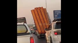 Truck Overloaded With Crates On Motorway