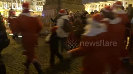 Scores of Santas race around St Petersburg square
