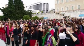 Feminist groups perform protest song outside Greek parliament