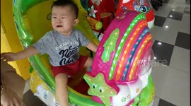 Adorable toddler terrified of riding a fun ride