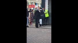 Police struggle with a suspect in Walthamstow, east London