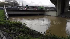 Heavy Rainfall Causes The River Roding In London To Burst Its Banks