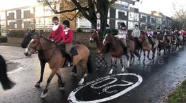 Christmas spirit! Even the King's Troop wear festive jumpers for their traditional ride through London