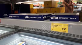 Empty shelves for festive essentials at Aldi on Christmas Eve
