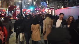 Christmas Eve Shoppers Down Oxford Street and Regents Street In London
