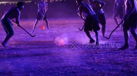 Locals play 'fire hockey' with ball of burning embers in northern Thailand