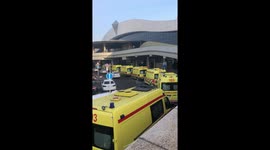 Line of ambulances seen outside Almaty airport after plane crash kills at least 15