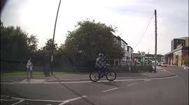 Cyclist fails to give way to learner car on roundabout then rides onto pavement