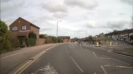 Learner on a mock test turn right into a minor road on the wrong side