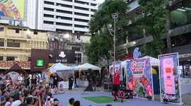 Street performer impresses with football keepy-uppy with metal pole