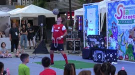 Street Performer Does Football Freestyle