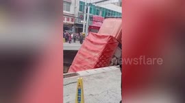 Truck falls into huge sinkhole that opens up on road in central China