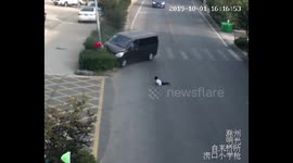 Boy narrowly escapes being run over by minibus in China