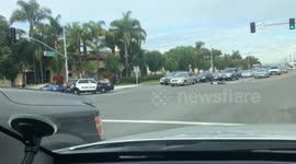 Man held at gunpoint by police in intersection
