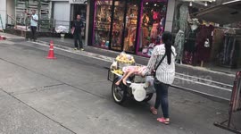 Little Girl Sleeps On Her Mother's Food Cart