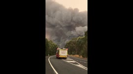 Fire engines rush towards large bushfire on the South Coast of New South Wales, Australia