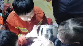 Chinese firefighters free toddler with head trapped in kettle