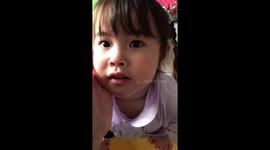Adorable toddler washes her mum's feet for her birthday
