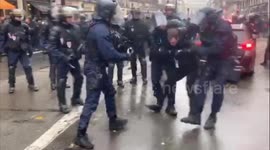 French police violently detain protester on streets of Paris during extended strike