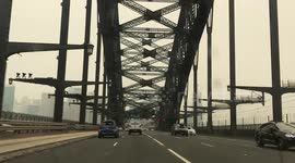 View of a blood red sun from the Sydney Harbour Bridge as the city fills with bushfire smoke
