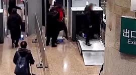 Chinese man climbs through train station security scanner as he 'didn't bother to take off belongings'