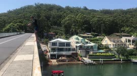 triple backflip off huge bridge
