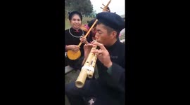 Man in Vietnam plays enchanting tune on bamboo 'double flute'