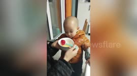 Ingenious mother uses strawberry to trick son into taking medicine