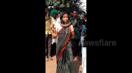 Woman in Indian village saves snake from being killed then dances with it