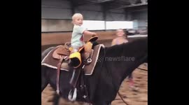 Young toddler in Slovakia is able to ride horse solo