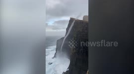 Incredible moment water flowed UPWARDS in Faroe Islands - after waves were caught in a rare sea vortex