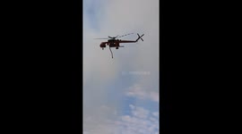 Waterbombing helicopter douses flames during bushfire in Forrestfield, Perth
