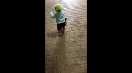 Todller running with cat