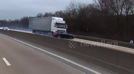 Moment T-boned car gets dragged by truck on Britain's busiest motorway