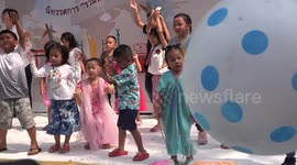 Children's day party at a temple grounds, in Thailand.