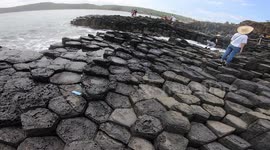 Tourists flock to volcanic rock formation in Vietnam which looks like honeycomb