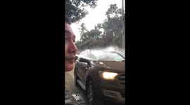Good samaritan uses power washer to rid windscreens of ash after volcano erupts in the Philippines