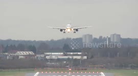 Planes battle against crosswinds from Storm Brendan as they land at Birmingham Airport