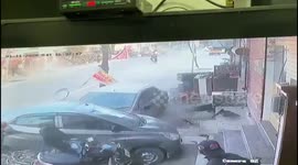 Driver still at large after speeding car hits cyclists before losing control and crashing into parked car in northern India