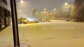 Crazy moment snowplow gets stuck going up icy hill in Vancouver